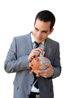 Businessman With The Piggy Bank Stock Image