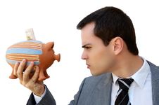Businessman Against The Money Pig Stock Image