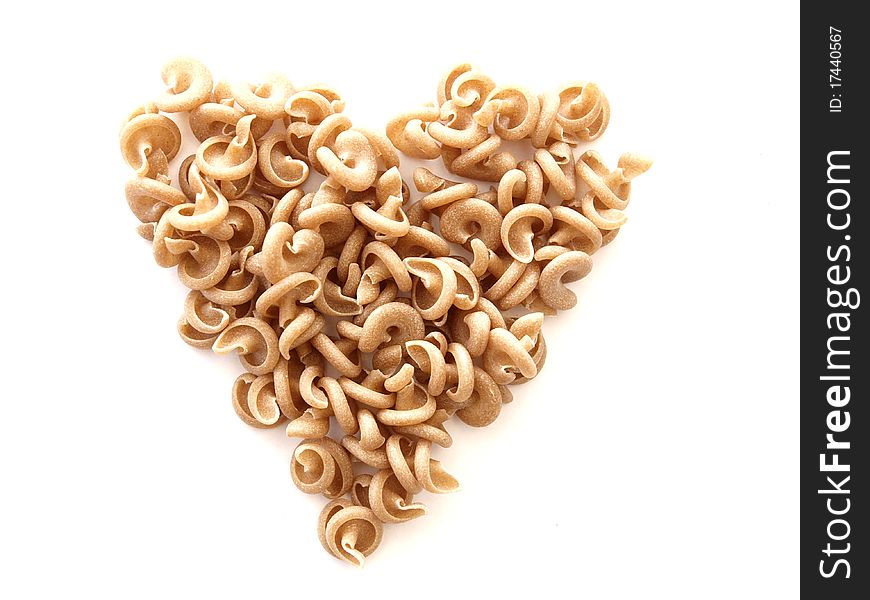 A pasta heart on white background