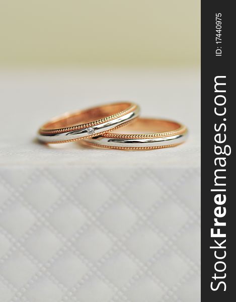 Pair Of Wedding Ring Sitting On Expensive Texture