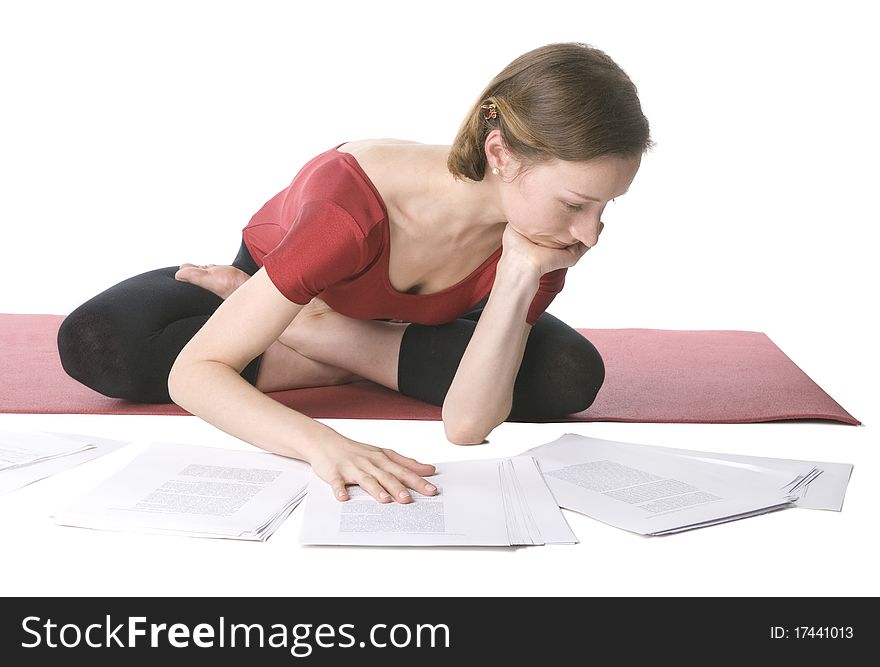 Young woman in sports clothes working with documents. Young woman in sports clothes working with documents