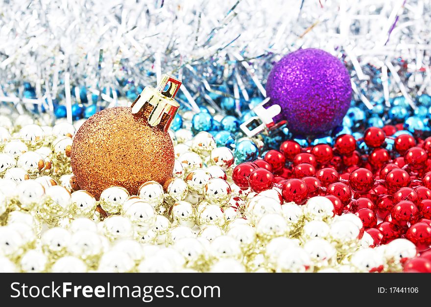 Christmas baubles and colorful pearls