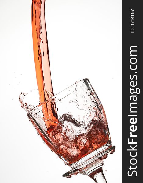 Splashing red drink isolated on the white