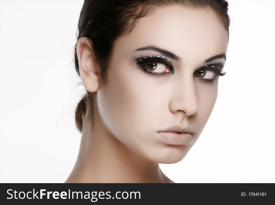 Studio portrait of young beautiful woman over white