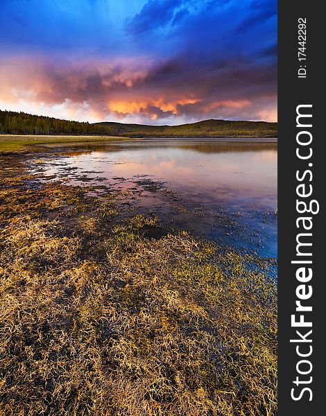 Sunset Under The Lake And Forest