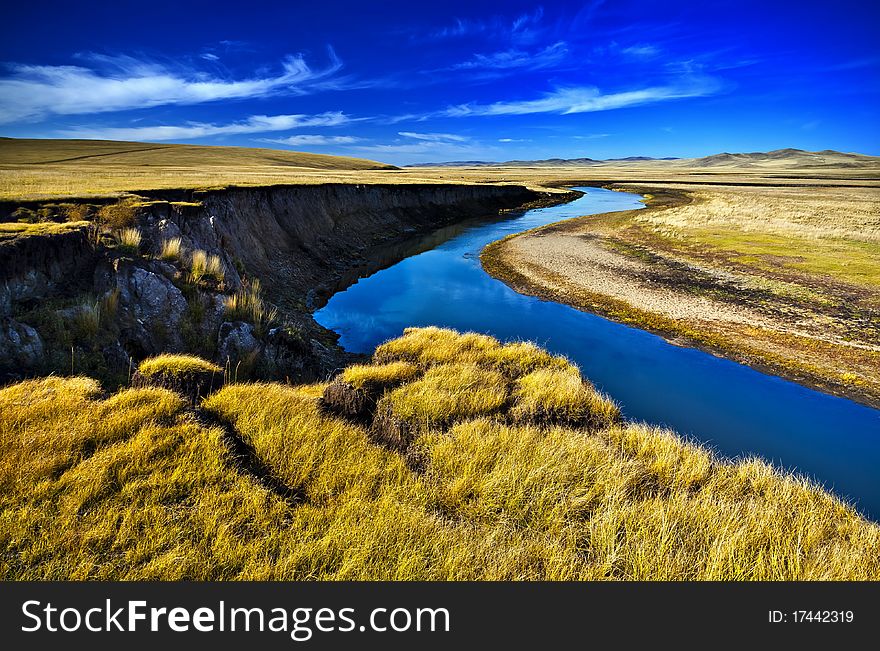 Stream between pastures and sky. Stream between pastures and sky.