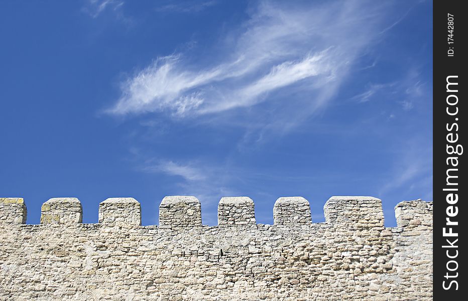 Merlons of an old fortress wall in a sunny day