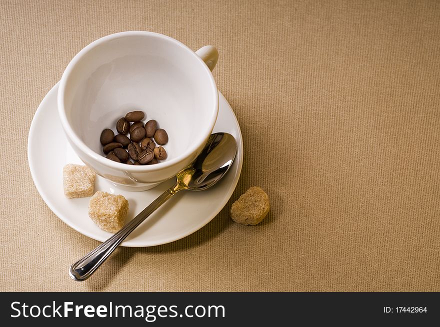 Coffee cup with bean and brown sugar