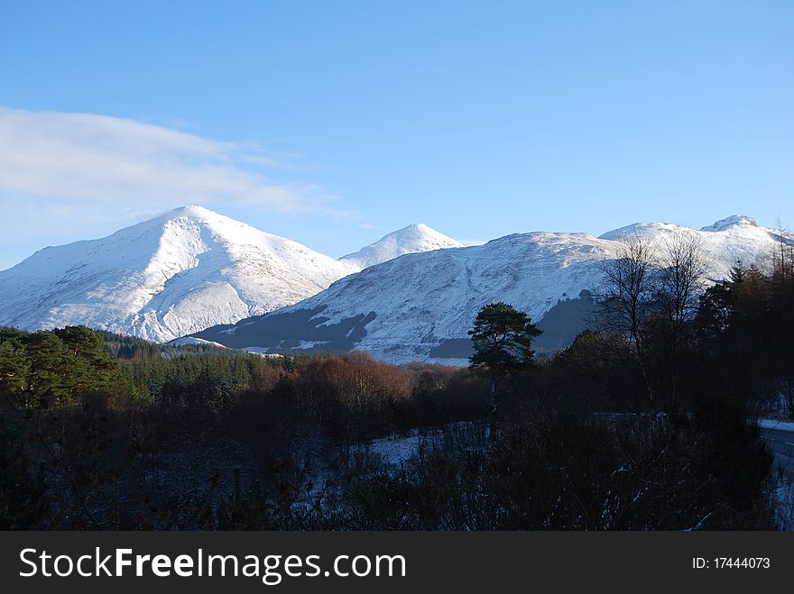A winters view of the hills above the Scottish highland town of Crainlarich. A winters view of the hills above the Scottish highland town of Crainlarich