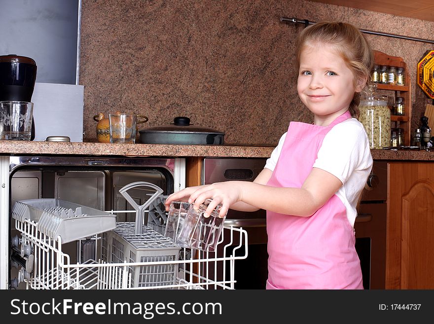 Girl taken glass from dishwasher