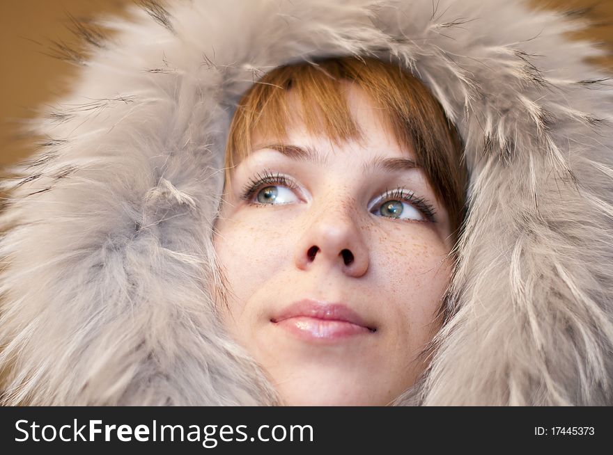 Young woman in a gray fur hood. Young woman in a gray fur hood