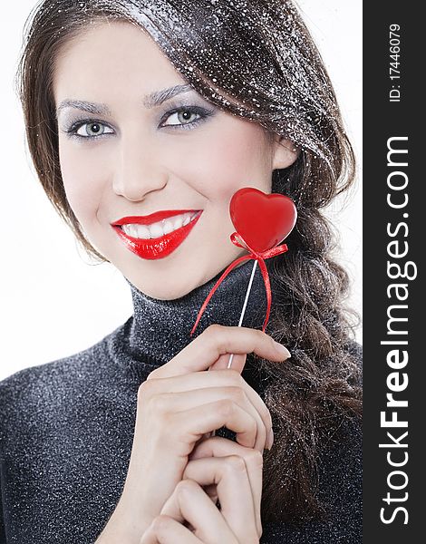 Beautiful smiling woman with heart on white background