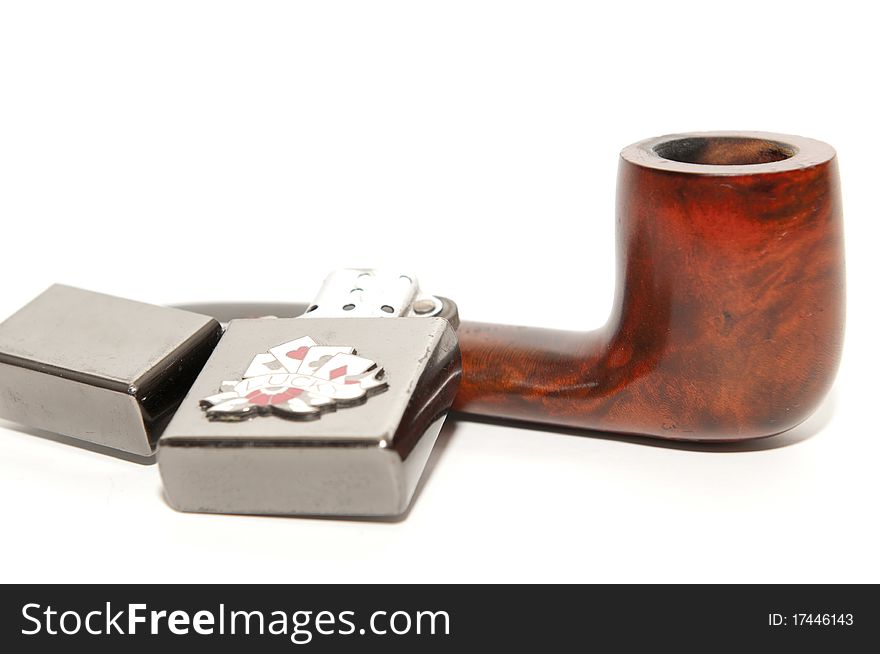 Smoking pipe and lighter on white background