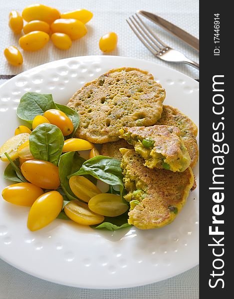 Homemade chickpea flour pancakes with fresh yellow tomatoes. Homemade chickpea flour pancakes with fresh yellow tomatoes