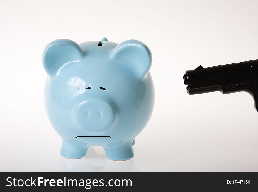 Blue piggy bank on white background being robbed. Blue piggy bank on white background being robbed