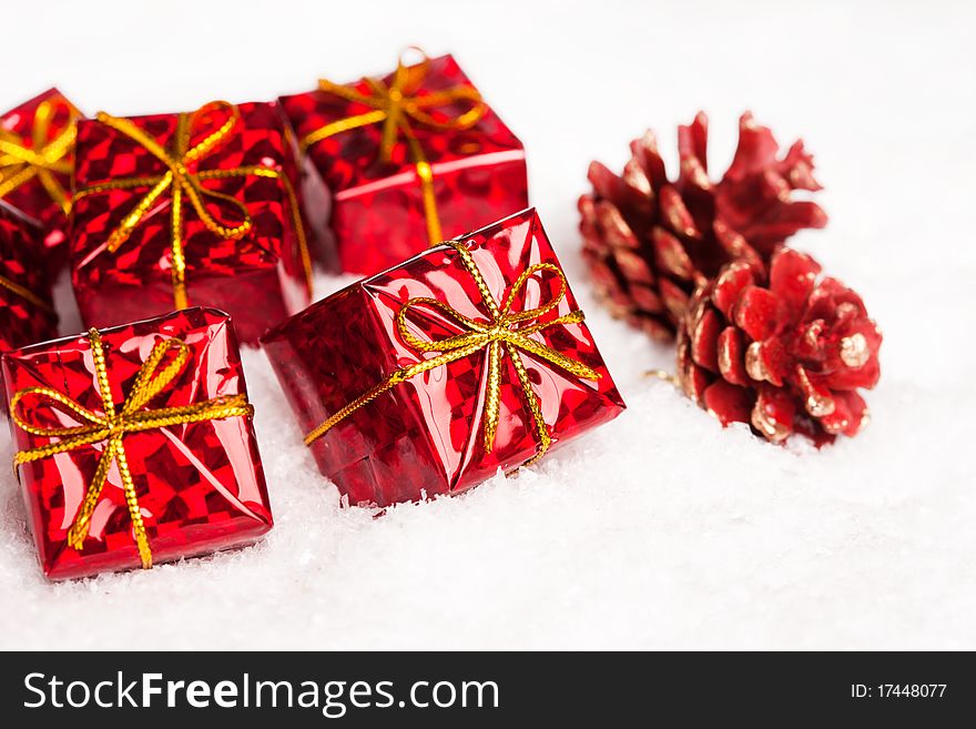 Red gift boxes with pinecone