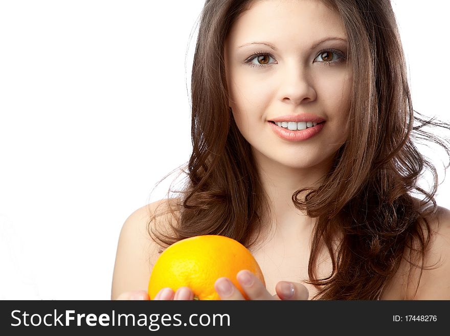 Beautiful young woman holding an orange. Close up. Beautiful young woman holding an orange. Close up