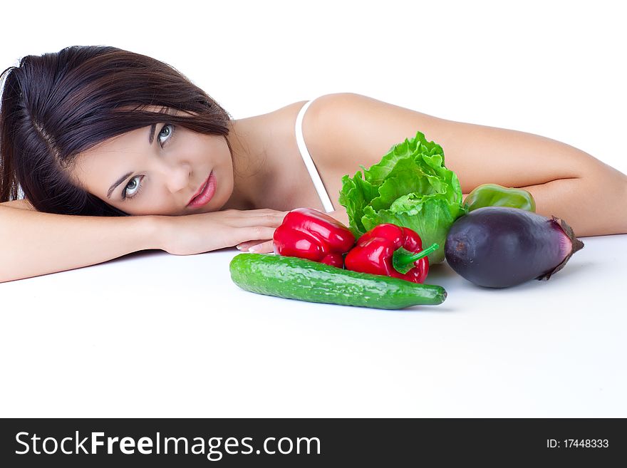 Young girl with vegetables over white background. Young girl with vegetables over white background