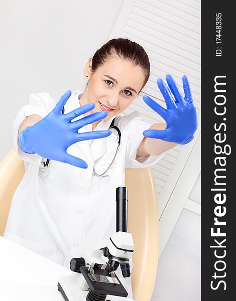 Medical - Female nurse looking in microscope