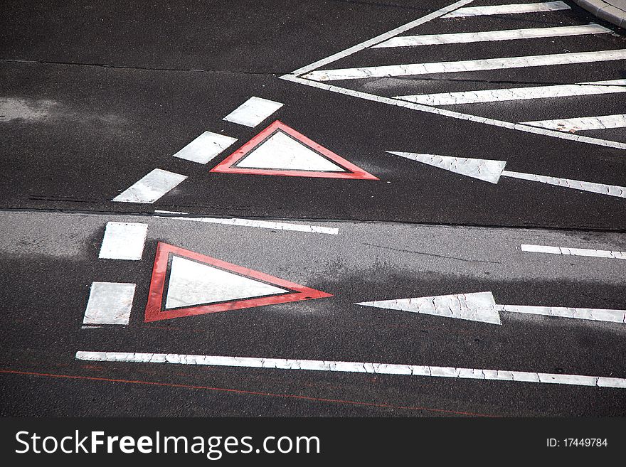 Yield sign marked at the street in vienna, Austria