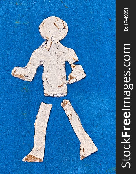 Symbol for pathway and icon for pedestrians on asphalt