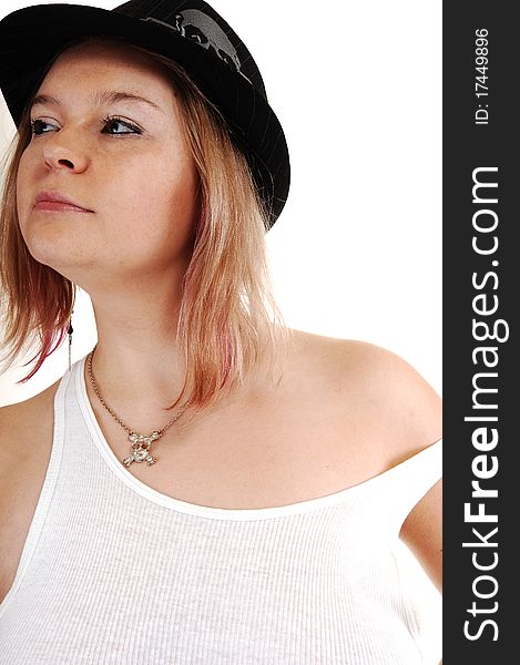 A young blond woman in an undershirt and a black hat on white
background. A young blond woman in an undershirt and a black hat on white
background.