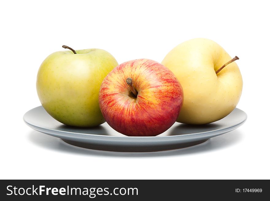 Apples on plate isolated on a white background