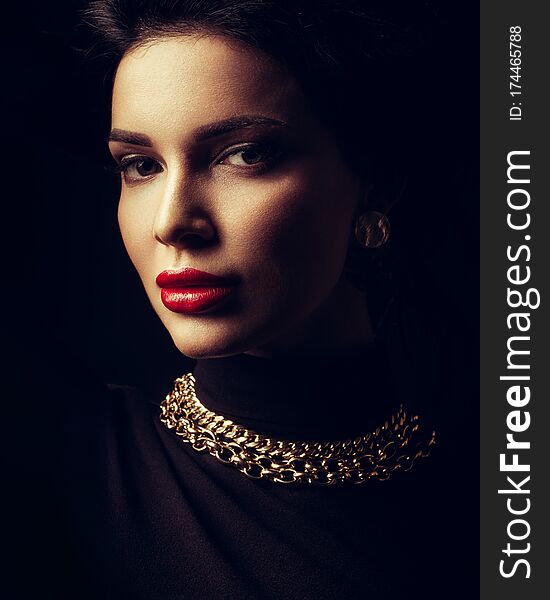 Young Lady With Luxury Accessories On Black Background