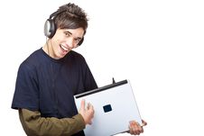 Teenager With Headphones Plays Guitar On Laptop Stock Images