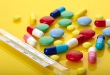Colorful Pills And Thermometer Stock Photography Colorful Pills And Thermometer Stock Photography