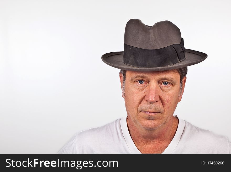 Smiling man with hat  isolated on a white background. Smiling man with hat  isolated on a white background