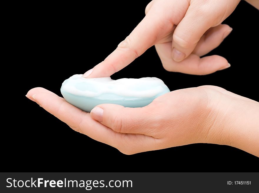 Soap in hand isolated on black background. Soap in hand isolated on black background