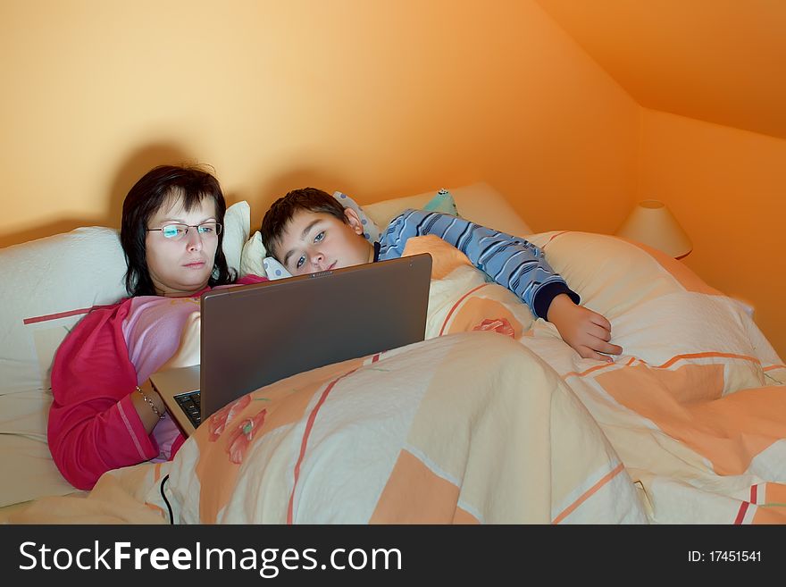 Portrait Of A Mother And Her Son Using Laptop