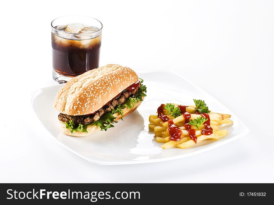 Ribeye steak in sesame seed bun with fries and coke. Ribeye steak in sesame seed bun with fries and coke