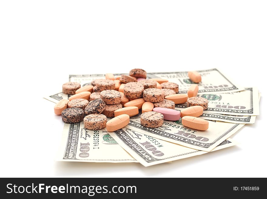 Drugs and money on a white background