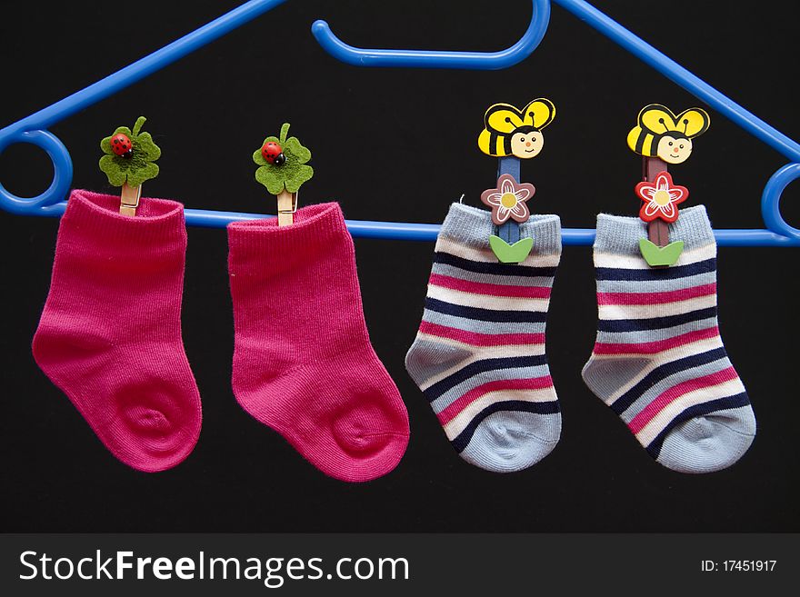 Child stockings hang on coat hanger