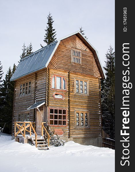 Three-storeyed wooden house concealed by snow