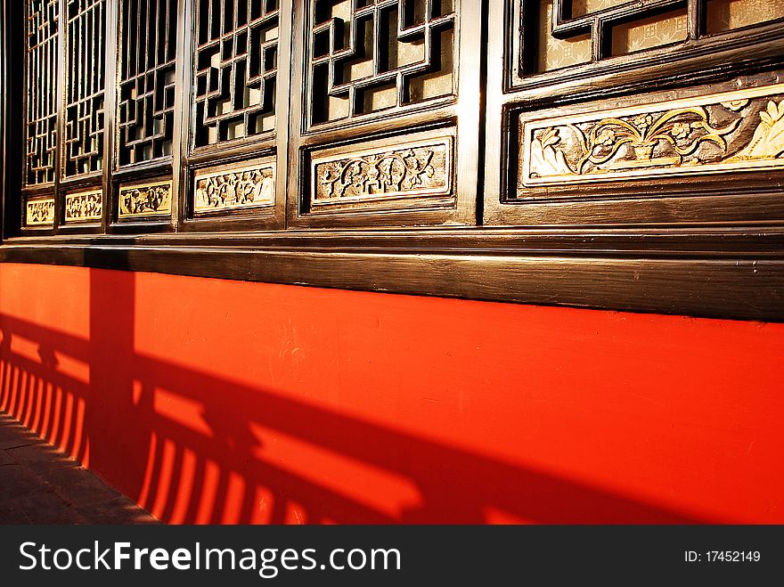 Traditional chinese windows in red wall. Traditional chinese windows in red wall