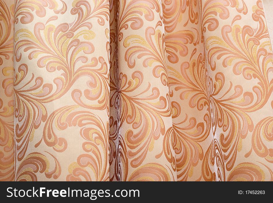 The background of textured of curtain fabric with a pattern closeup. The background of textured of curtain fabric with a pattern closeup