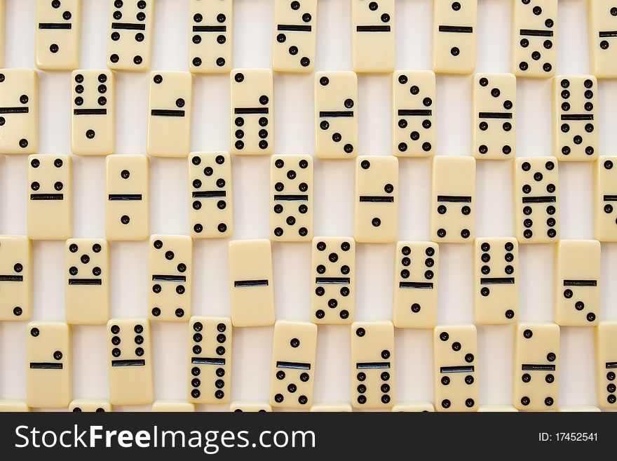 Domino-laying bricks on white background