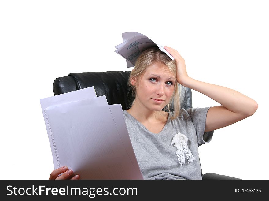 Desperate girl sitting in chair with paper sheets in hands