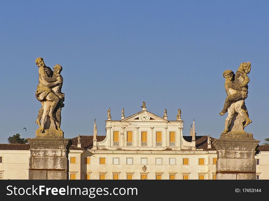 Facade of the Villa Manin palace in Passariano (Udine Province, Friuli-Venezia-Giulia region (FVG), Italy, Europe; sculptures of lovers at the entrance to the estate *with space for text (copyspace). Facade of the Villa Manin palace in Passariano (Udine Province, Friuli-Venezia-Giulia region (FVG), Italy, Europe; sculptures of lovers at the entrance to the estate *with space for text (copyspace)