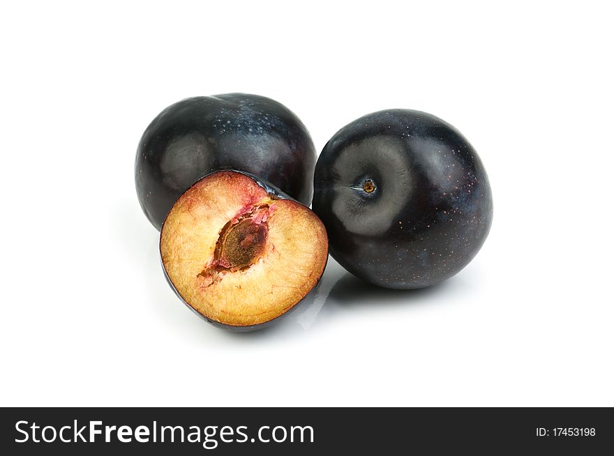 Two plum isolated on white