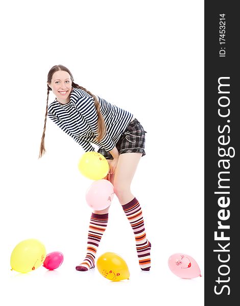 A pretty girl dressed in casual clothes playing with baloons. A pretty girl dressed in casual clothes playing with baloons