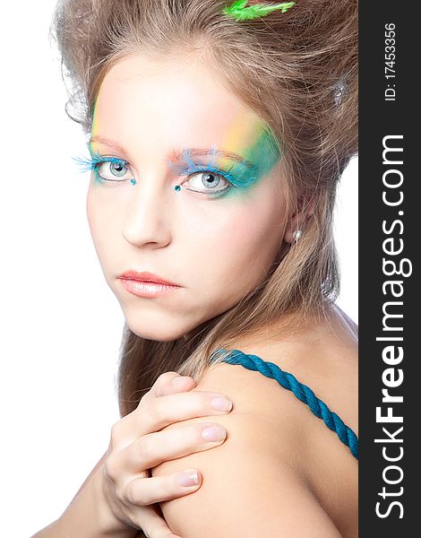 Beautiful woman  with color makeup over white background