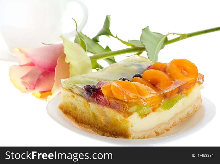 Close-up curd cake with fruits and rose, isolated on white