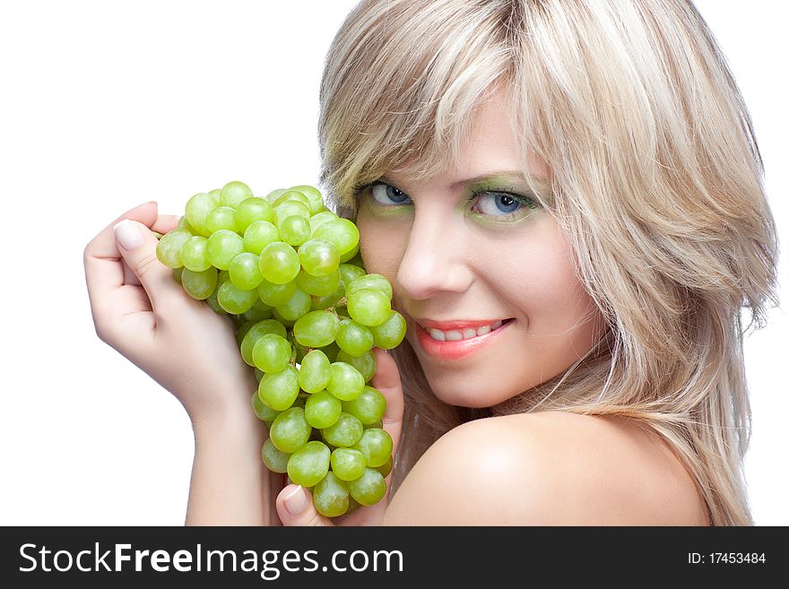 Young girl with grape