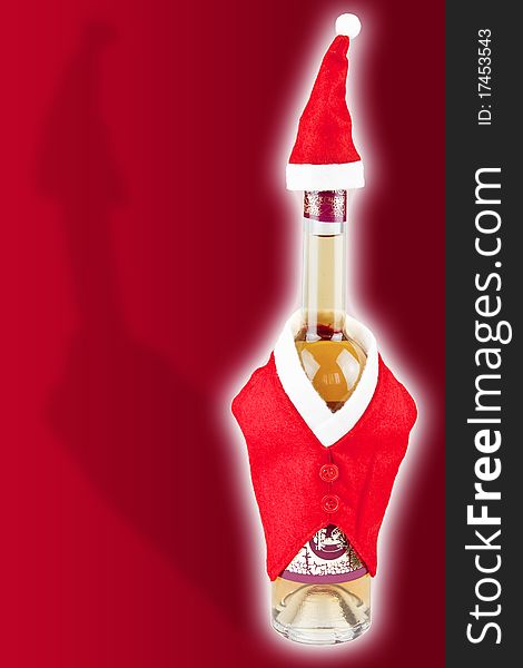 Wine bottle with christmas cover isolated on red background