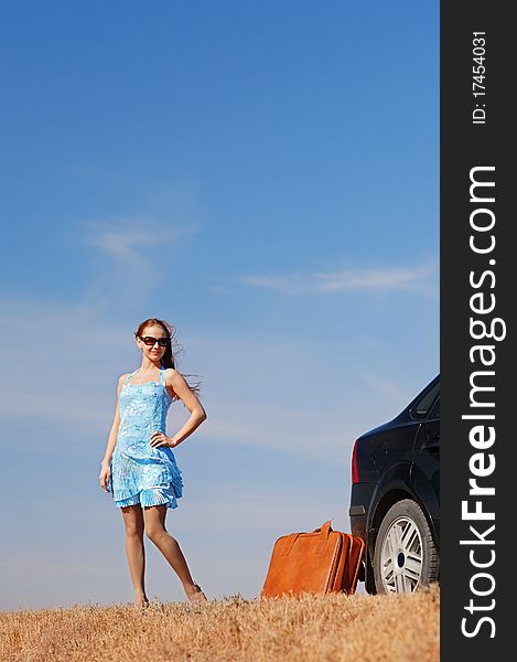 Young girl near the car