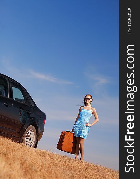 Young girl near the car